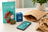 Plain Jane flower packaging beside a mailer and an abstract tracking route