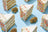 Plain Jane flower buds styled with colorful cake slices in a real product photograph