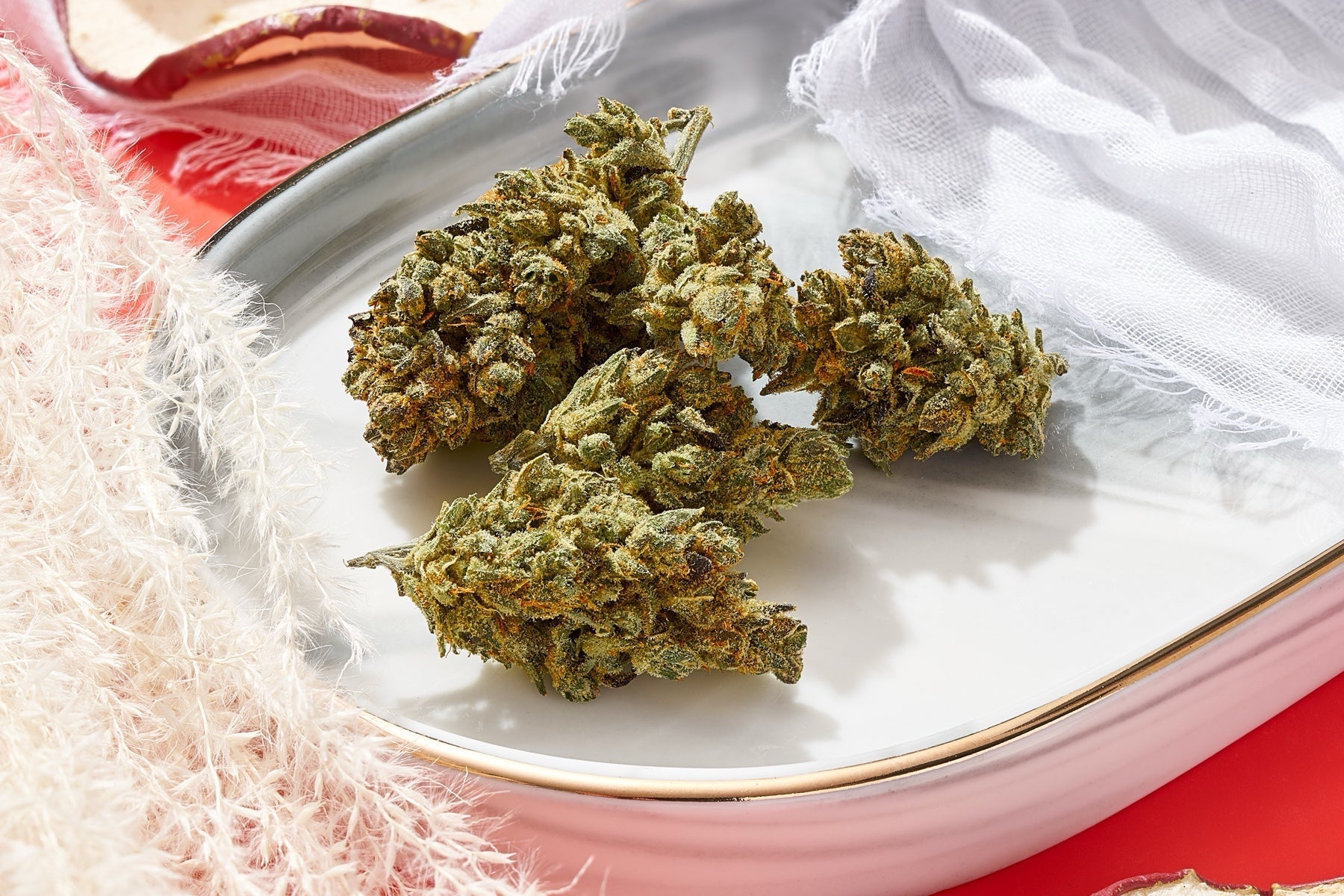 Plain Jane flower buds styled with apple slices in a real aroma-themed photograph
