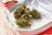 Plain Jane flower buds styled with apple slices in a real aroma-themed photograph