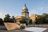 Illinois state capitol with hemp flower and policy research materials