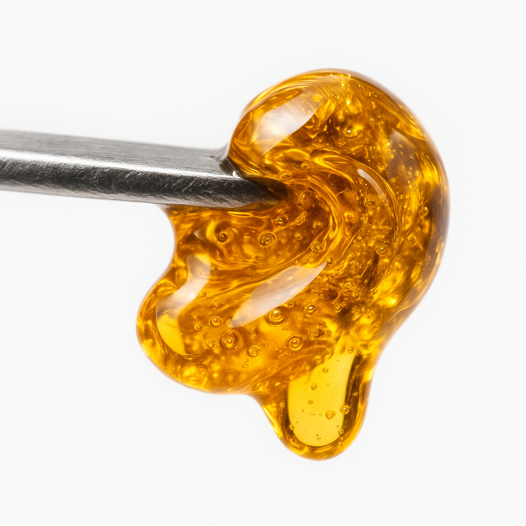 Melted CBD shatter on dab tool 