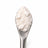 CBD Isolate on a stainless steel concentrate tool against a clean white background