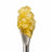 THCA Diamond Sauce on a stainless steel concentrate tool against a clean white background