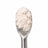THCA isolate powder on a stainless steel spoon against a white background
