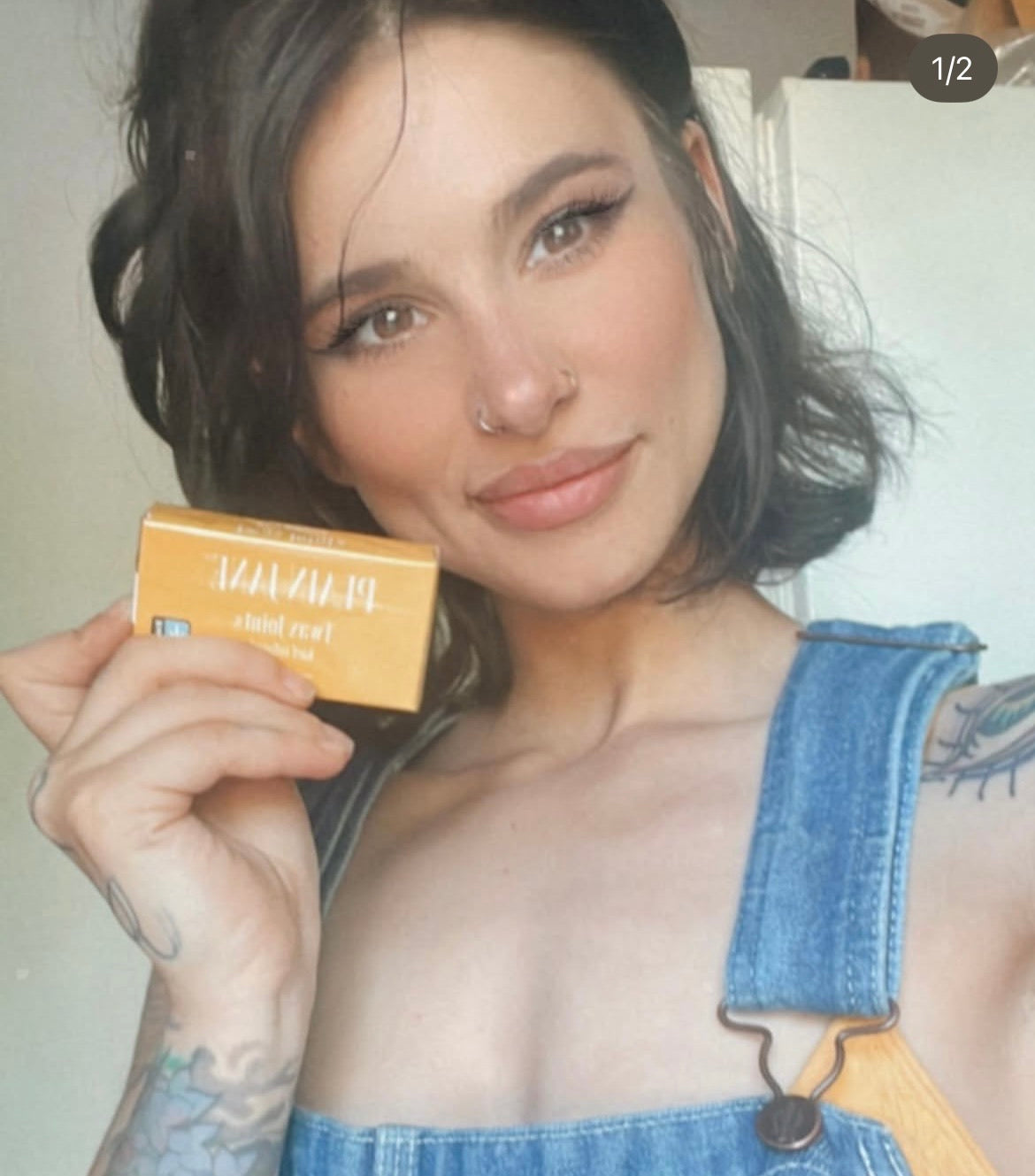 Plain Jane customer holding a branded hemp-roll package