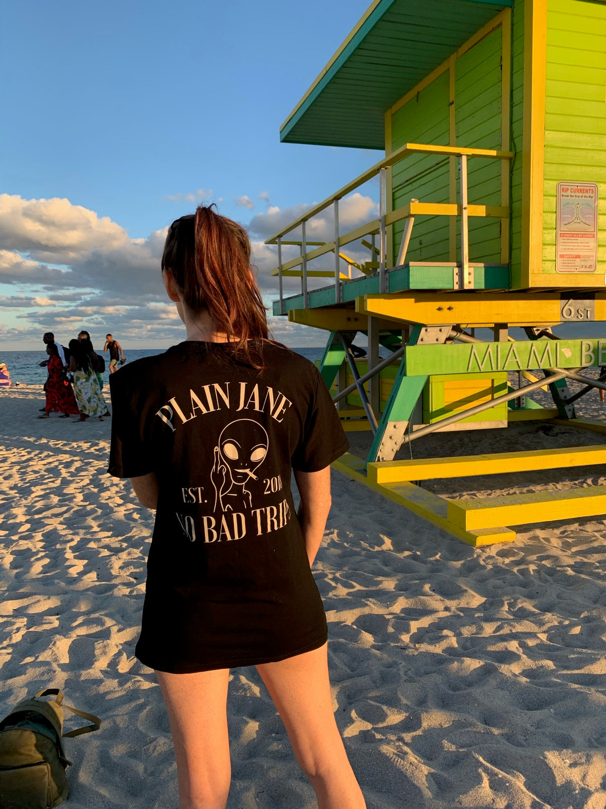 Person wearing a Plain Jane shirt at the beach