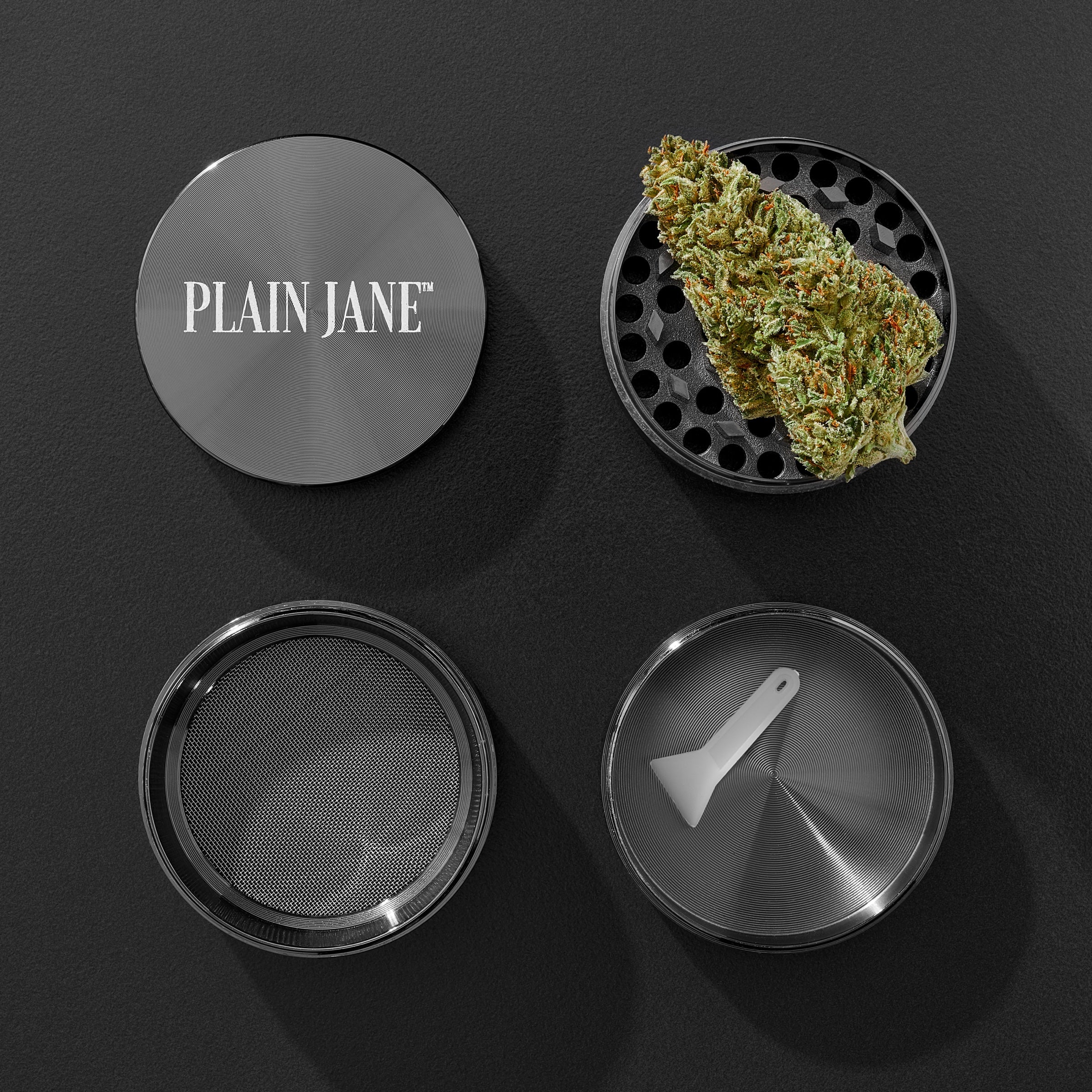 Gunmetal grinder shown in an overhead breakdown