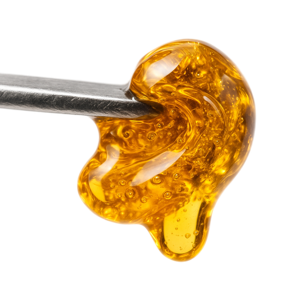 Melted CBD shatter on dab tool 