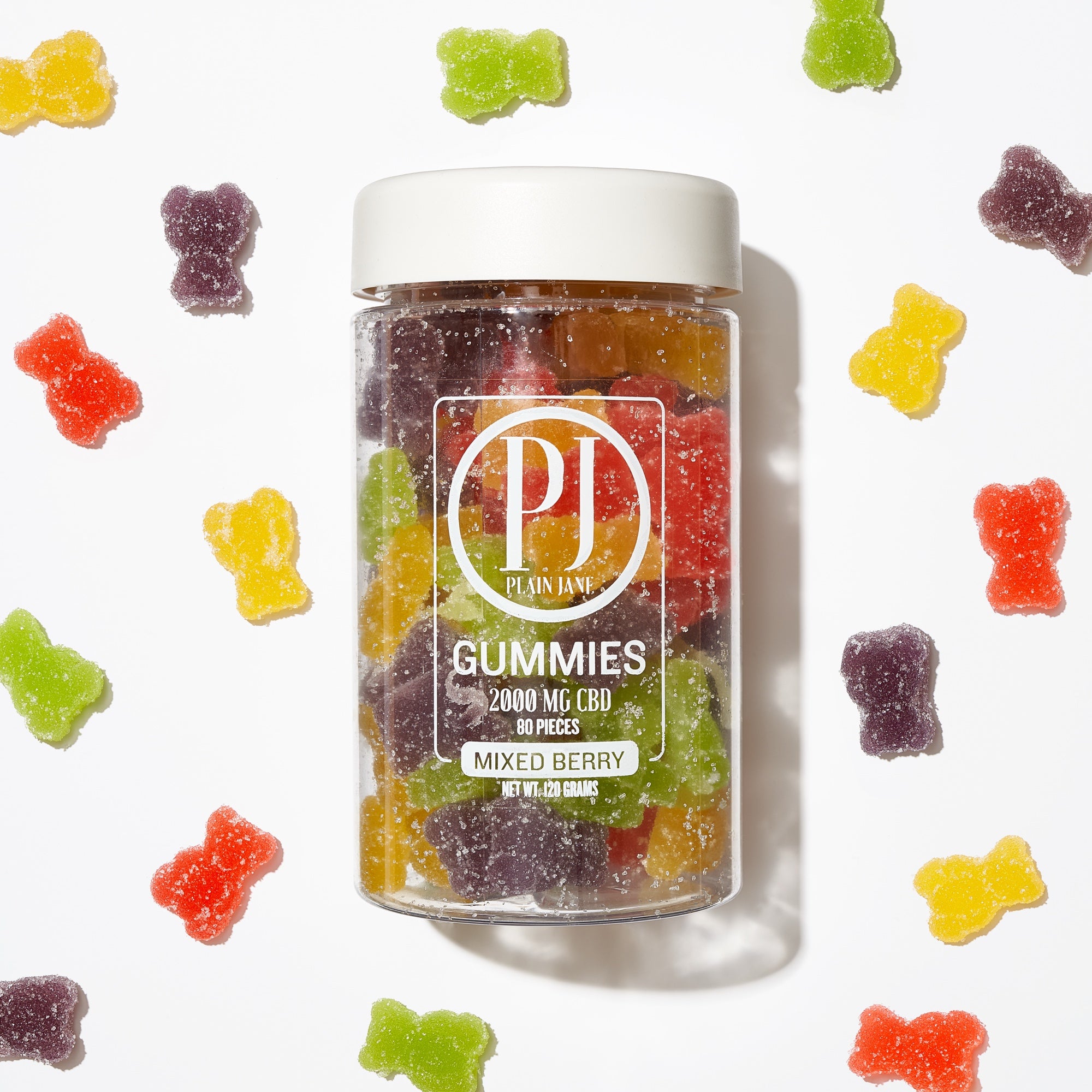 Plain Jane gummies in a clear jar surrounded by colorful gummies